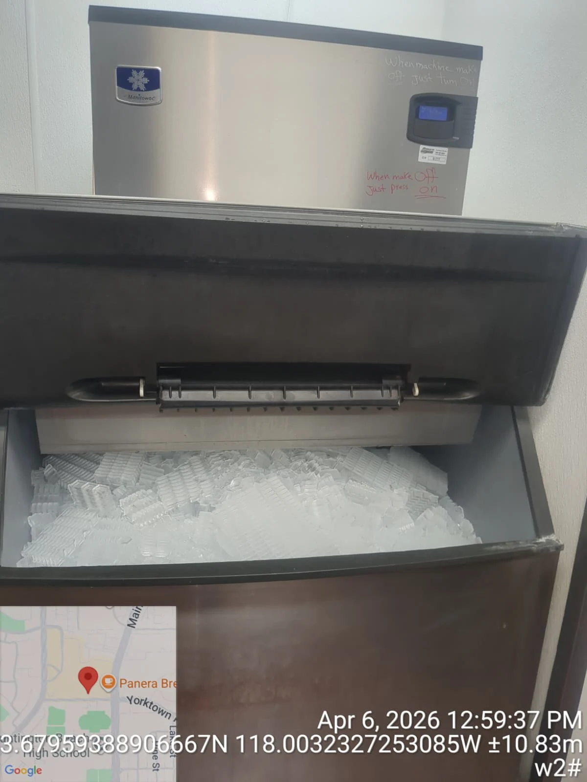 Commercial Manitowoc ice machine with open ice bin