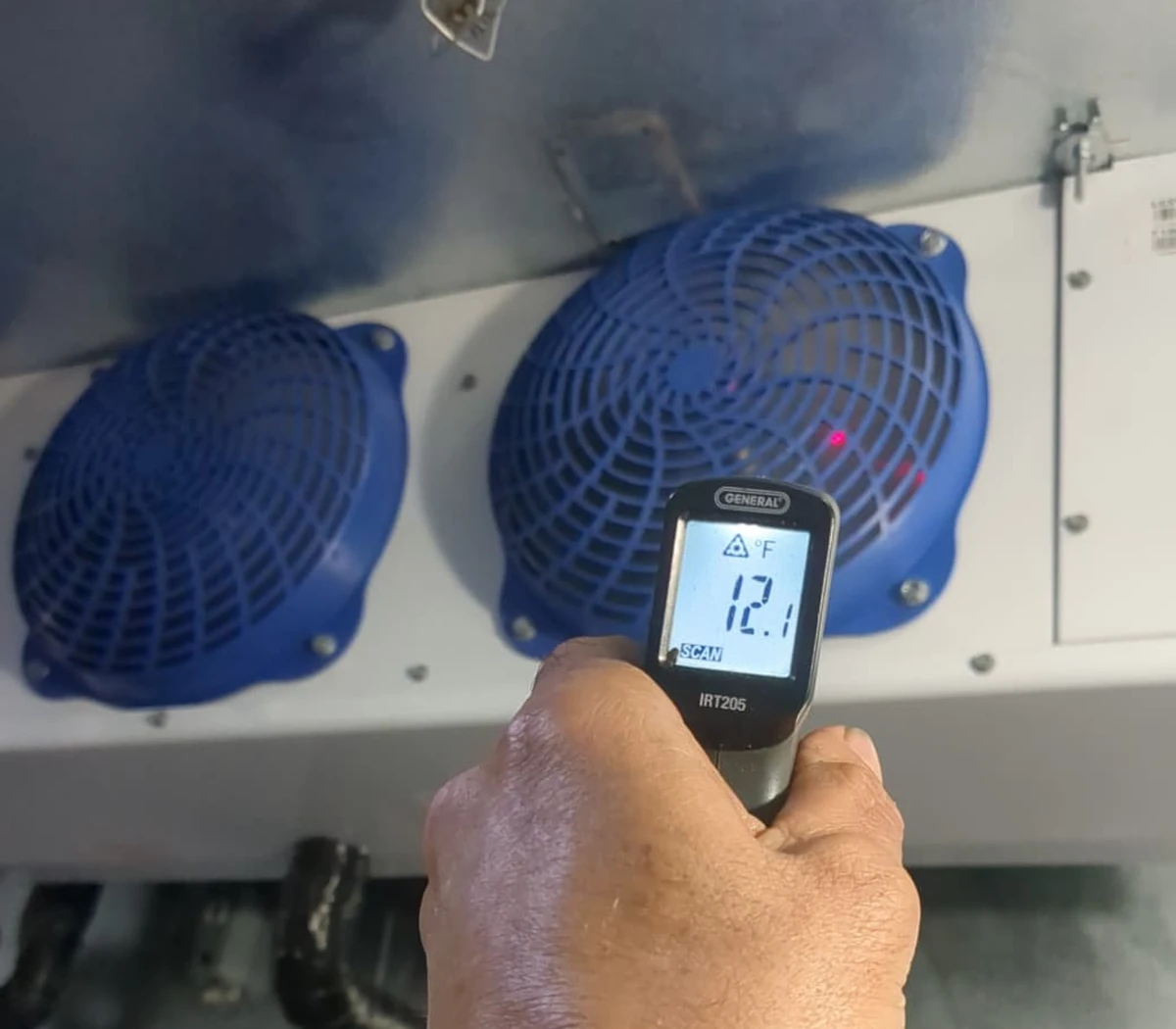Walk-in cooler evaporator temperature reading with infrared thermometer